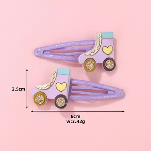 Detalle de pinzas para el pelo de patines con purpurina para niños de 6cm x 2,5cm