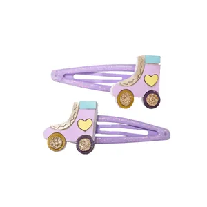 Juego de 2 clips de pelo morados con purpurina para niñas con diseño de patines con lentejuelas