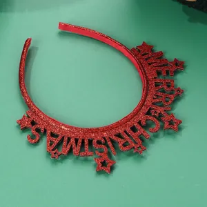 Macro detail of red Merry Christmas headband with glitter stars and festive lettering