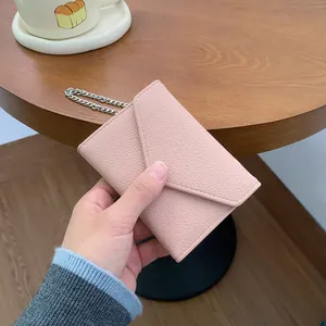 Pink lychee texture mini wallet with V-shaped flap and elegant silver chain strap