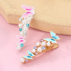 Chic butterfly hair clip set with pink and blue enamel and faux pearls for women