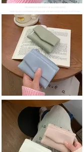 Detail of macaron color envelope wallets with fine stitching and side zipper design