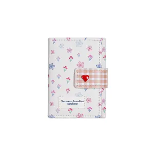 Floral trifold wallet with pink flowers and brown checkered heart buckle strap