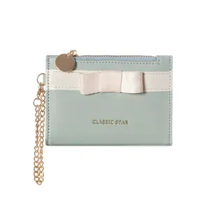 Short mint green PU leather wallet with elegant cream bow and gold classic star lettering