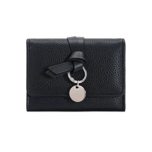Minimalist black pebble grain wallet with a stylish leather tie and silver ring charm