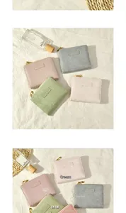 Flat lay of colorful lychee texture leather wallets in cream, pink, and matcha green colors