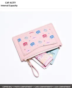 Detail view of pink leather mini wallet showing internal card slots and coin pocket