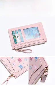 Detail view of pink PU leather wallet showing three card slots and clear ID window