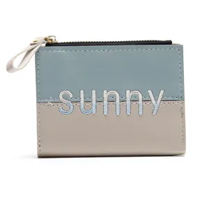 Stylish bicolor puzzle zipper wallet with Sunny embroidery and leather puller detail