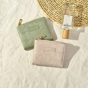 Short square pleated women's wallet in green and pink with L-shaped metal zipper