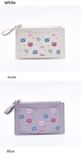 Close-up of PU leather coin purses featuring cute cartoon bear patterns and card slots
