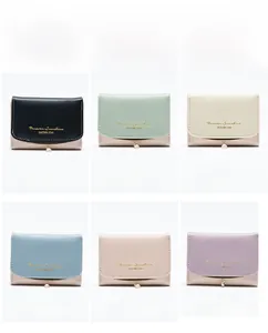Short faux leather wallets for women in six colors featuring pearl charms and gold prints