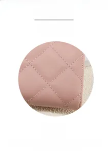 Close-up of pink quilted PU leather wallet featuring elegant diamond stitching details