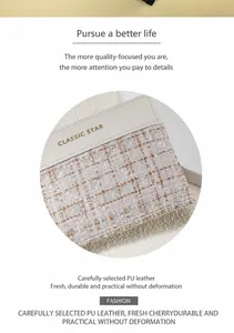 Detailed macro view of the tweed and cream PU leather texture with gold lettering