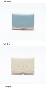 Detail view of tri-fold wallets in green and white PU leather with pearl charms
