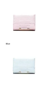 Detail of pink and blue faux crocodile texture PU leather wallets with gold metal bar