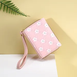 Pink lychee texture short wallet for women with white star print and wrist strap