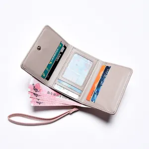 Short tri-fold apricot leather women's wallet with multi-card slots and wrist strap