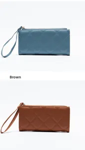 Detailed view of long quilted wallets in light blue and brown with wrist straps