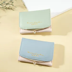 Short tri-fold PU leather wallet for women with pearl charm and gold-toned curved edges