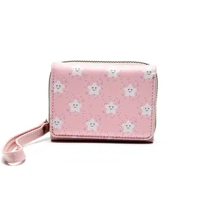 Pink short wallet with white star pattern, metal zipper, and matching leather wrist strap