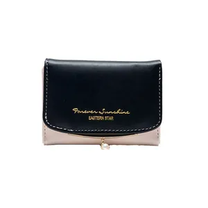 Short bi-fold wallet for women with pink and black contrast leather and pearl pendant