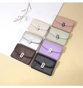 Colección de monederos de cuero PU con hebillas metálicas creativas en forma de cuchilla