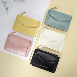 Mini porte-clés en cuir PU en cinq couleurs avec fermeture éclair et poche avant