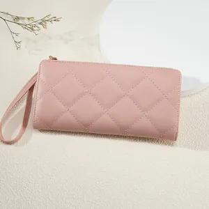 Pink quilted leather long wallet for women with wristlet and secure zipper closure