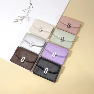 Carteras de cuero sintético con hebillas metálicas en forma de cuchilla en 7 colores variados