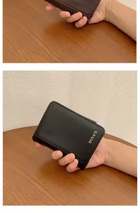 Close-up of black PU leather wallet with BOYA'S logo and fine stitching details