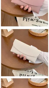 Detailed view of women long flap wallets in cream white and light purple faux leather