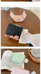 Internal details of a tri-fold wallet showing card slots and a transparent photo window