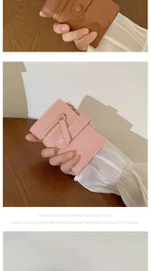 Detail of compact women's wallets with smooth stitching and secure zipper closure