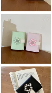 Detail of colorful PU leather mini wallets featuring checkered sunflower magnetic buckles