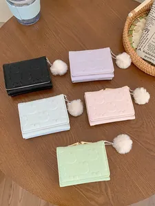 Short fold women's wallet in five pastel colors with embossed rabbit patterns and pom pom charm