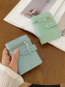 Women's minimalist PU leather short wallets in mint green and light blue with gold zipper