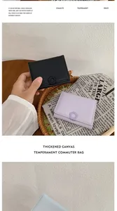 Detail of mini tri-fold wallets in black and lavender with floral snap buttons