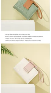 Details geprägter Blumenmuster auf PU-Ledergeldbörsen mit Handschlaufen für Damen