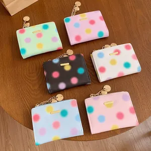 Portafogli donna a pois in sei colori con cerniera dorata e ciondolo a cuore