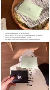 Détails de portefeuilles pliables avec logo chat en vert menthe et cuir noir