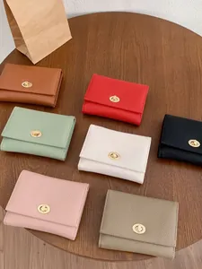 Portafogli da donna in pelle martellata con chiusura a rotazione in metallo in sette colori