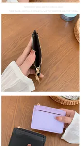 Detail of slim card holder showing zipper compartment and precise stitching quality