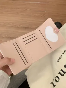 Pink trifold leather wallet for women with heart window and cute bear ornament