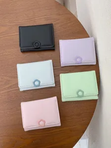 Mini trifold faux leather wallets for women in five pastel colors with flower clasp