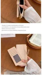 Détails d'un portefeuille long en cuir beige avec fentes pour cartes et fermeture éclair