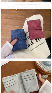 Detail of vintage matte leather wallets with card slots and metallic snap closure