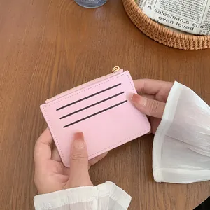 Pink faux leather card holder wallet with zipper and three card slots for women