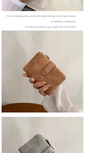 Detail of vintage matte leather wallets in brown and grey with metal snap and long strap