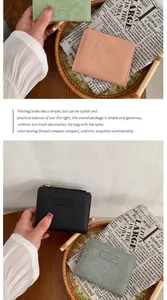 Short vintage wallets in pink, green, and black with leather texture and brand label